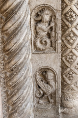 Carving on the Facade of the cathedral in Ferrara Italy