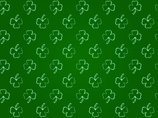 seamless texture with green shamrock.