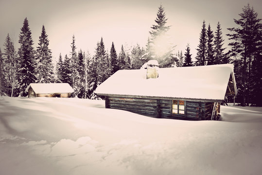 Vintage log cabin in snow