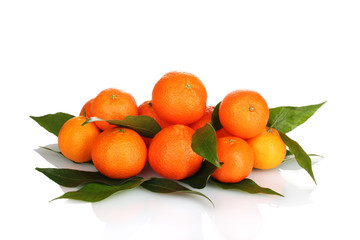 Ripe tasty tangerines with leaves isolated on white