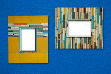 old colorful wooden frame on blue wall