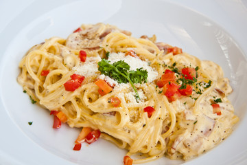 Spaghetti carbonara on white plate