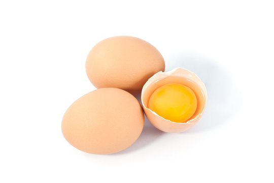 eggs on a white background. One egg is broken
