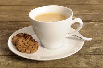 cup of coffee on old weathered wooden table