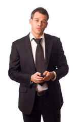 a young businessman holding a phone.