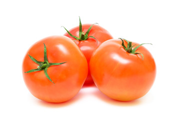 ripe tomatoes on a white background