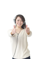 Asian woman listening music