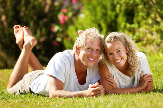 Happy young couple outdoors.