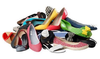 Pile of various female shoes over white, with clipping path