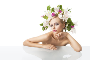 pretty blond with flower crown on head, her chin is resting on l