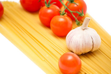 Spaghetti and tomatoes on a white background