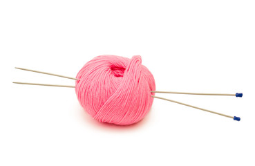 pink ball and knitting needles on a white background