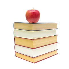 red apple and a stack of books isolated on white background