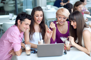 Young people browsing internet in a restaurant