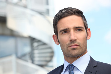 Smart man looking away outdoors