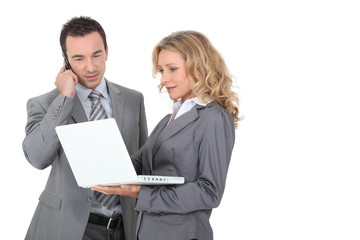 Executive couple with a laptop