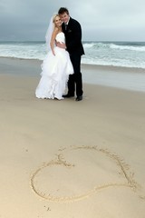 Fototapeta na wymiar Lovely Wedding Couple at the Sea Side