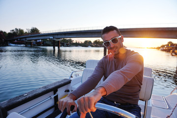 portrait of happy young man on boat