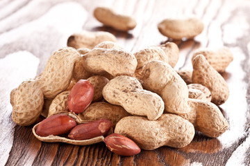 Peanuts on a wooden table.