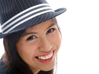 smiling girl wearing fedora hat