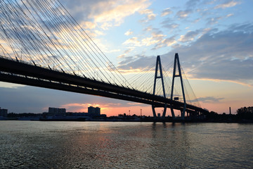 Fototapeta na wymiar Cable-braced bridge before dawn in St.Petersburg.