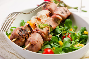 Meat Skewers on white table