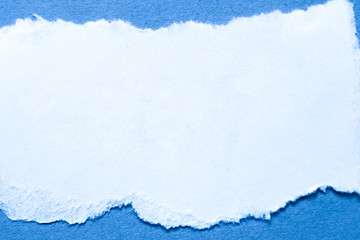 A piece of paper on blue