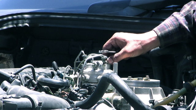 auto mechanic repairing a car engine