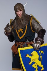 Medieval knight isolated on grey background.