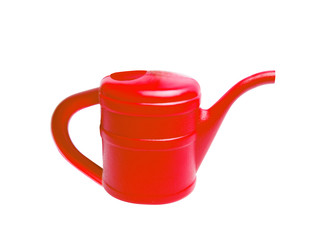 Red plastic watering can isolated on white