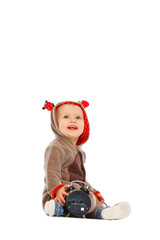 Baby in costume of Santa Claus's reindeer with alarm clock