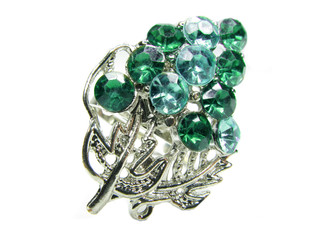 jewelry ring with bright green crystals