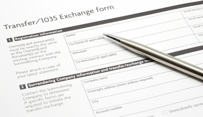 Section 1035 Exchange Paper Form with a Silver Pen - 38178895