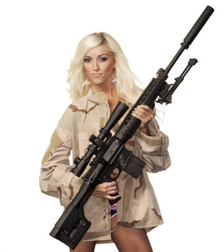 Beautiful young woman with powerful gun rifle