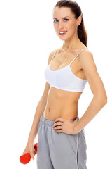 Fototapeta premium Pretty happy young woman exercising with free weights