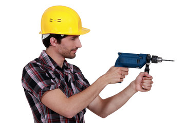 craftsman holding a drill