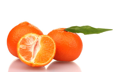 Ripe tasty tangerines with leaves and segments isolated on white