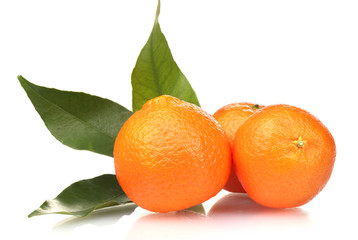 Ripe tasty tangerines with leaves isolated on white