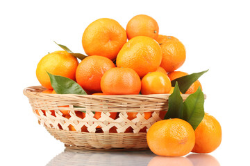 tangerines with leaves in a beautiful basket isolated on white