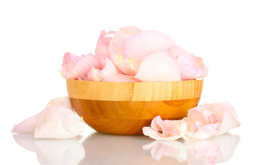 beautiful pink rose petals in wooden bowl isolated on white