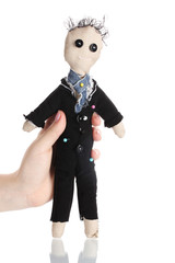 Voodoo doll boy-groom in the hands of women isolated on white