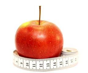Fresh red apple with measuring tape