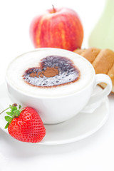 cappuccino in a cup in the shape of hearts,apple ,croissant  and