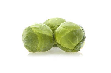 Fresh organic brussels sprouts isolated on white