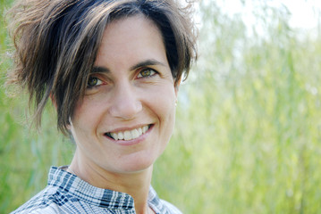 face of young woman smiling and nice outdoor portrait