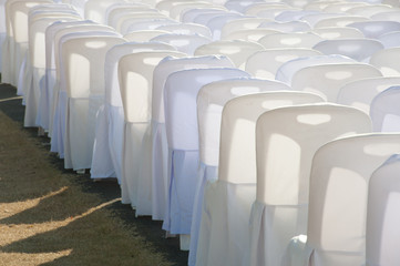 Group of white chairs .