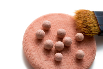 Blush in the form of beads on a white background
