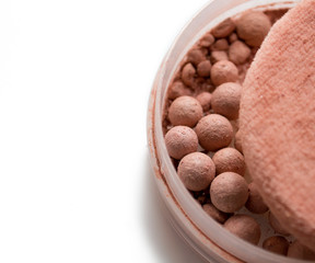Blush in the form of beads on a white background