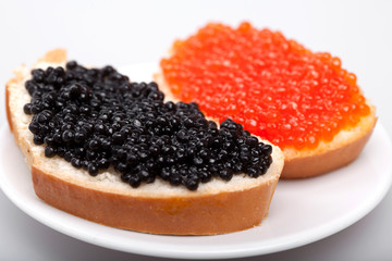 two sandwichs with red and black caviar