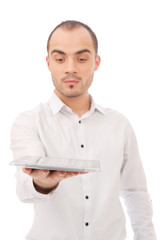 Handsome Casual Young Man Holding a Touch Pad Tablet PC on Isola